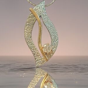 Gold and Silver Textured Necklace with Abstract Pendant